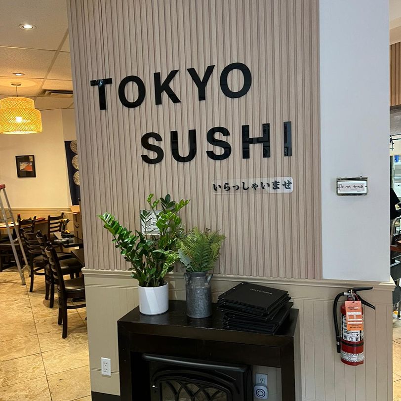 Tokyo Sushi in store logo on wall